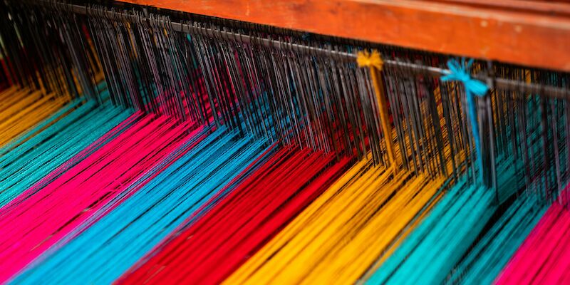 assorted-color textiles. Photo by Sergio Gonzalez, Unsplash.