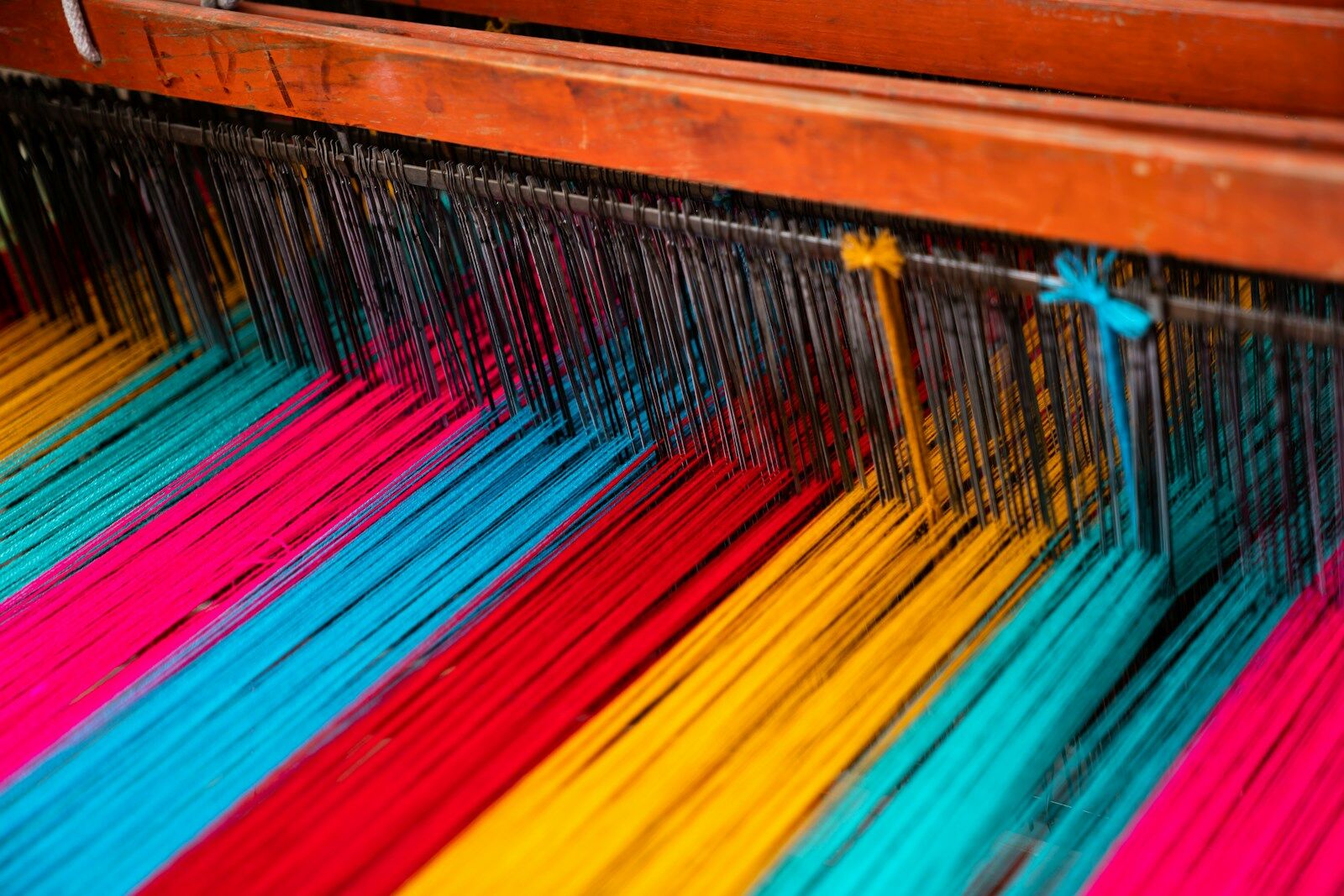 assorted-color textiles. Photo by Sergio Gonzalez, Unsplash.